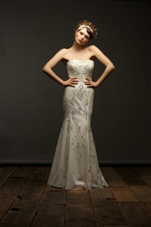 Bride Female model with brown hair posing in a wedding dress in McKinney, TX.