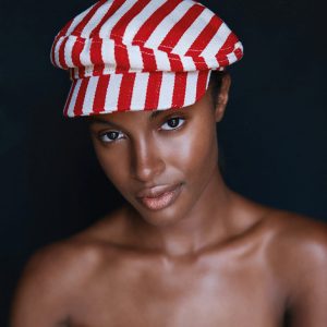 Beauty Portrait of a lady with a red and white cap on in McKinney, TX.