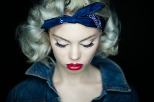 Red White and Blue Pretty model with long black eyelashes and red lips looking down in McKinney TX.